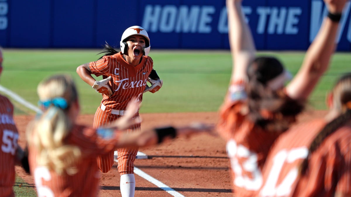 What impact does a weather delay at the Women’s College World Series have on Texas softball?