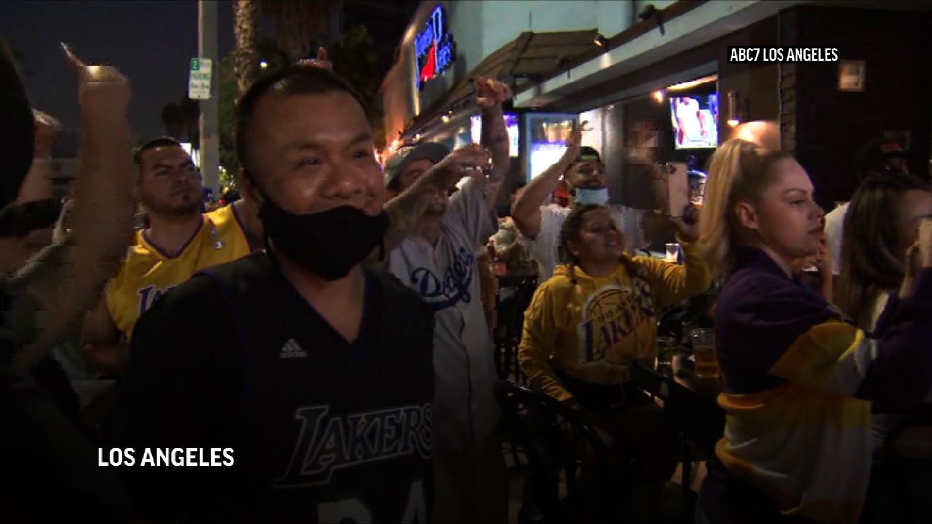 Fans, some rowdy, cheer Lakers win outside Staples Center