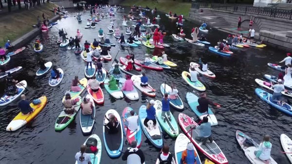 Thousands paddle through St Petersburg at Sup Fest