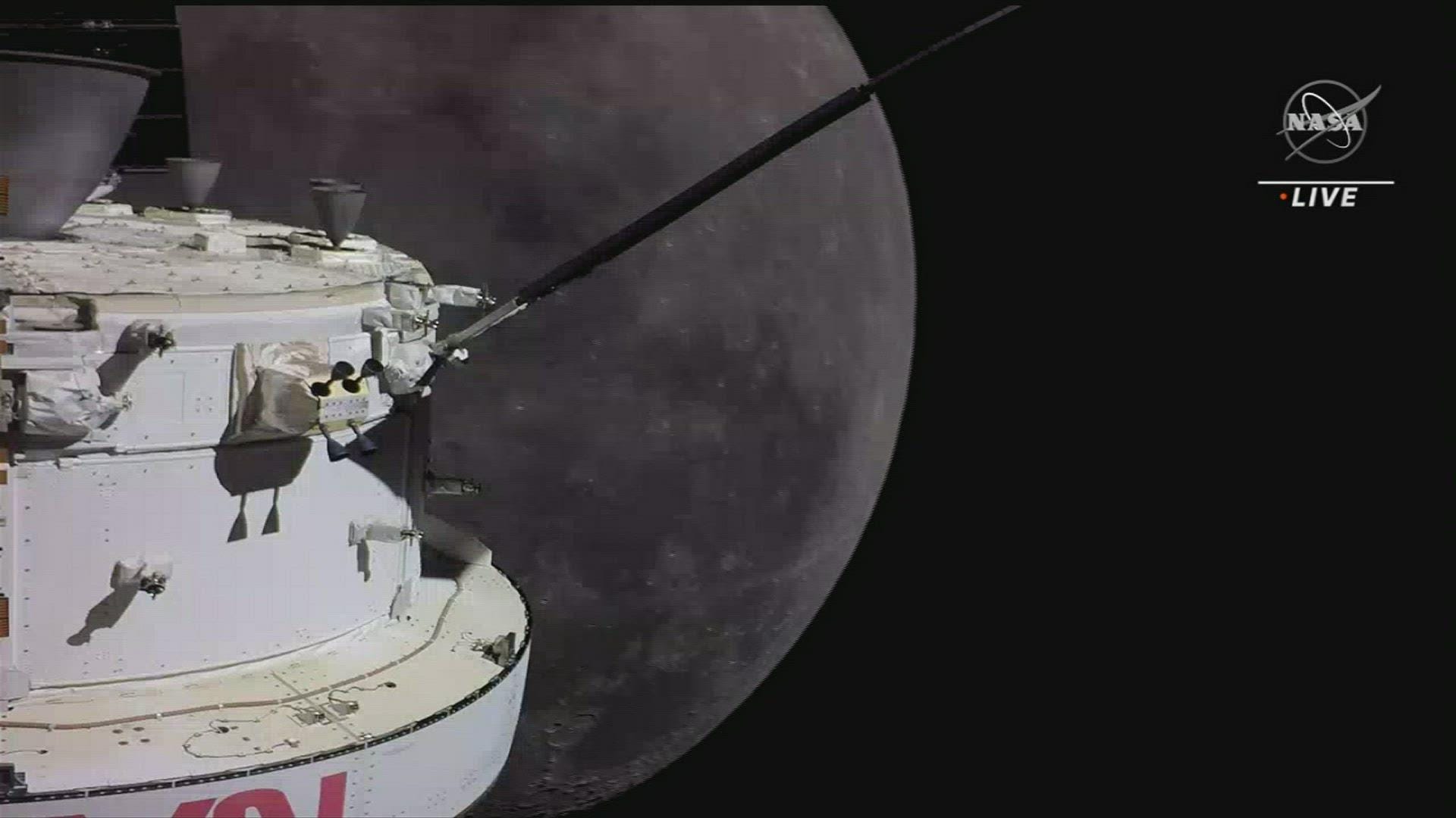 NASA's Moon Capsule Heads Home, Overflies History