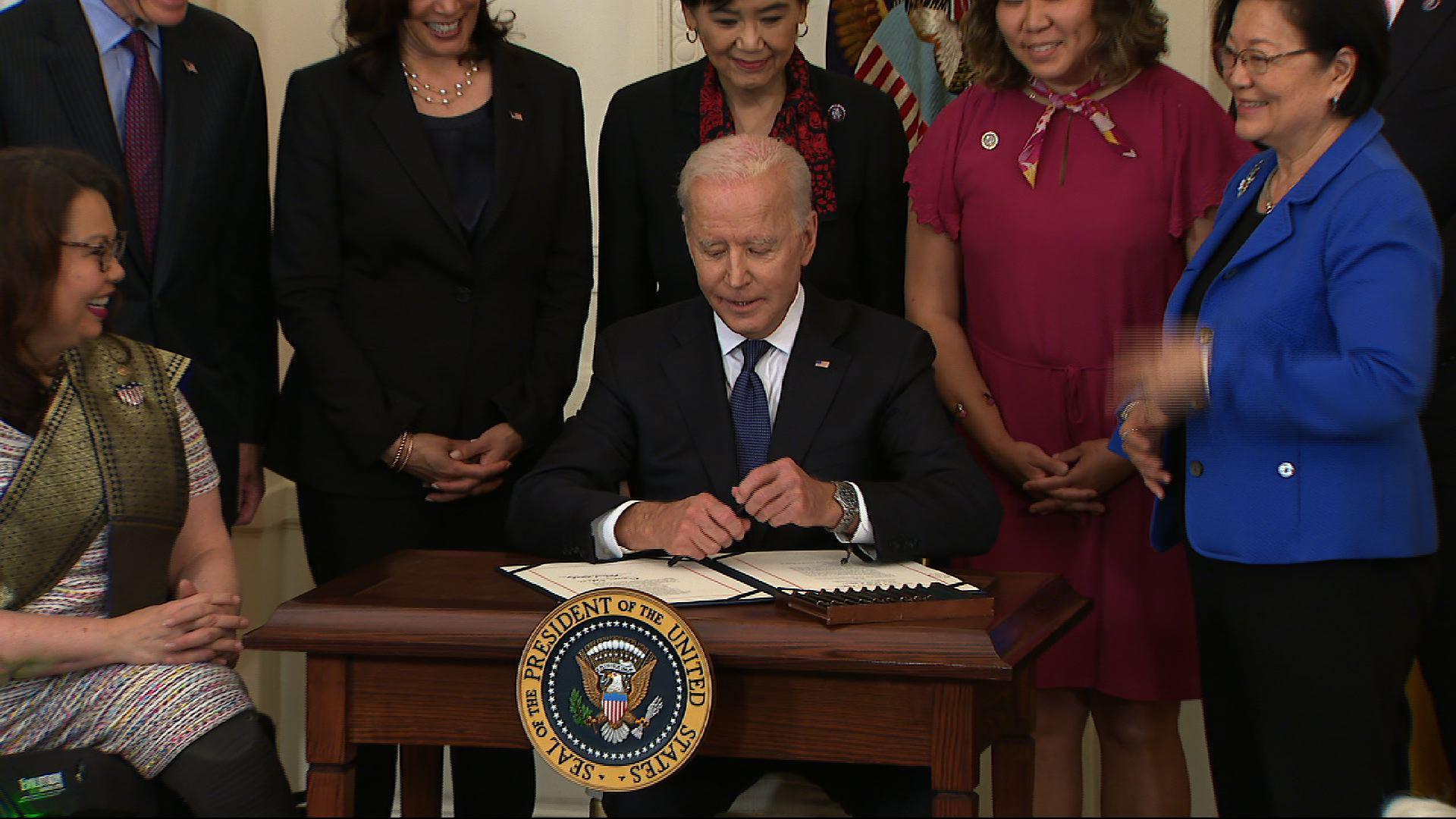 biden signs asian hate crime        
        <figure class=