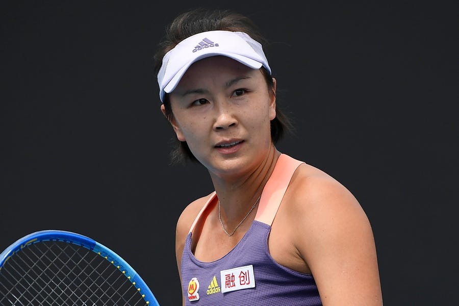 FILE - China's Peng Shuai reacts during her first round singles match against Japan's Nao Hibino at the Australian Open tennis championship in Melbourne, Australia on Jan. 21, 2020. The head of the women's professional tennis tour announced Wednesday, Dec. 1, 2021, that all WTA tournaments would be suspended in China because of concerns about the safety of Peng Shuai, a Grand Slam doubles champion who accused a former high-ranking government official in that country of sexual assault. (AP Photo/Andy   Brownbill, File)