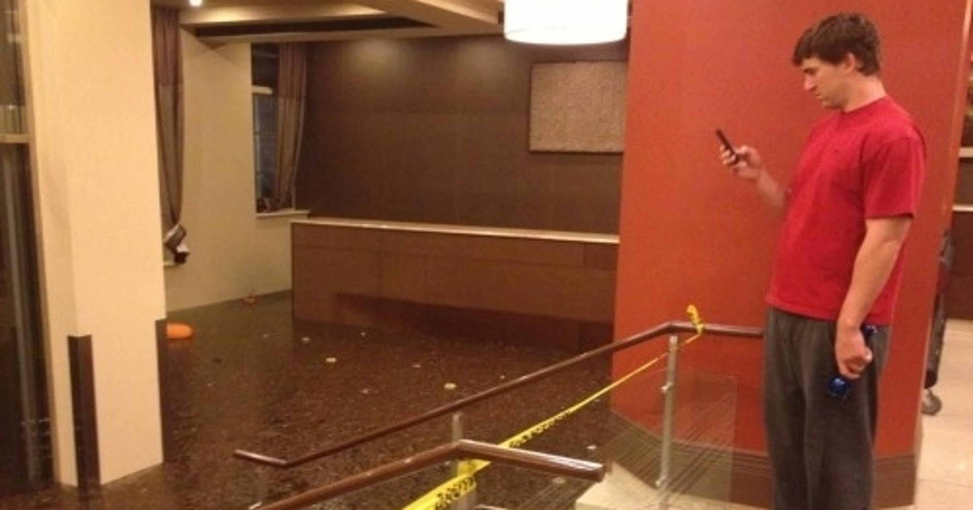 Eli Manning In The Lobby Of His Flooded Apartment Building After Hurricane Sandy Photo
