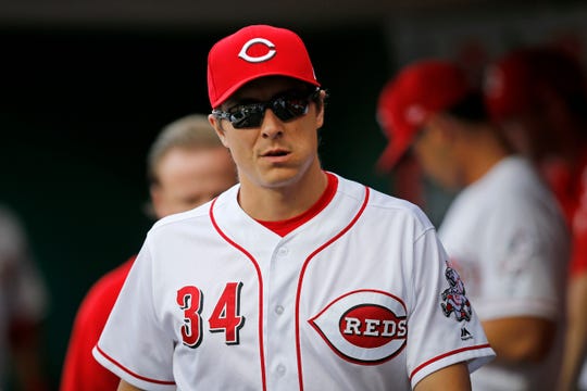 Cincinnati Reds starting pitcher Homer Bailey (34) walks the dugout on an off night in the first inning of the MLB National League game between the Cincinnati Reds and the Philadelphia Phillies at Great American Ball Park in downtown Cincinnati on Friday, July 27, 2018.