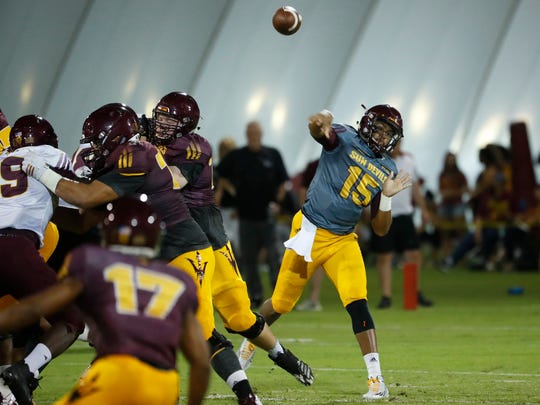 ASU's Dillon Sterling-Cole (15) throws a pass during the ASU scrimmage at Kajikawa Practice Fields in Tempe, Ariz. on Aug. 11, 2018. 