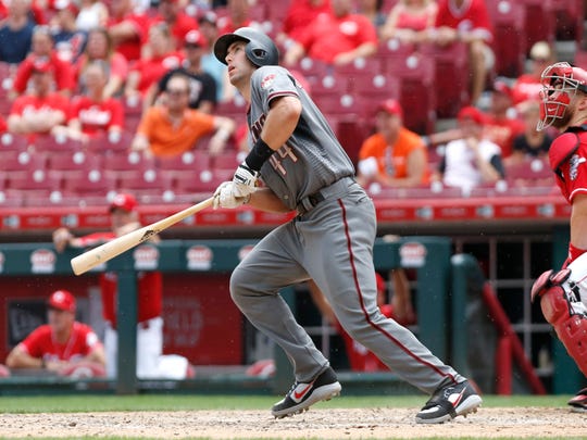 Diamondbacks first baseman Paul Goldschmidt hits a solo home run against the Reds during the ninth inning of a game Aug. 12 at the Great American Ball Park.