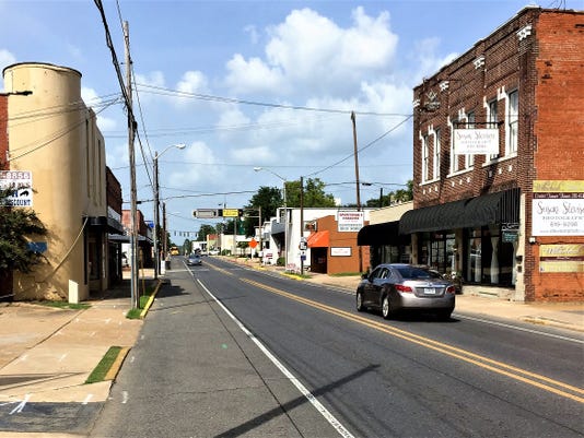 What does Pineville plan for its downtown?