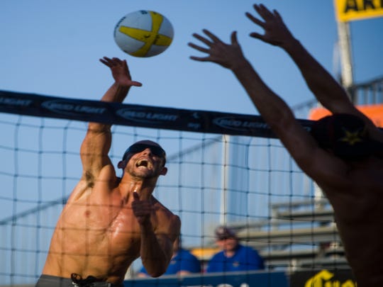 Nick Lucena spikes the ball during a match at the AVP Best of the Beach professional volleyball tournament  in Glendale on Sept. 26, 2008. The tournament was played in the Westgate Entertainment District for a few years.
