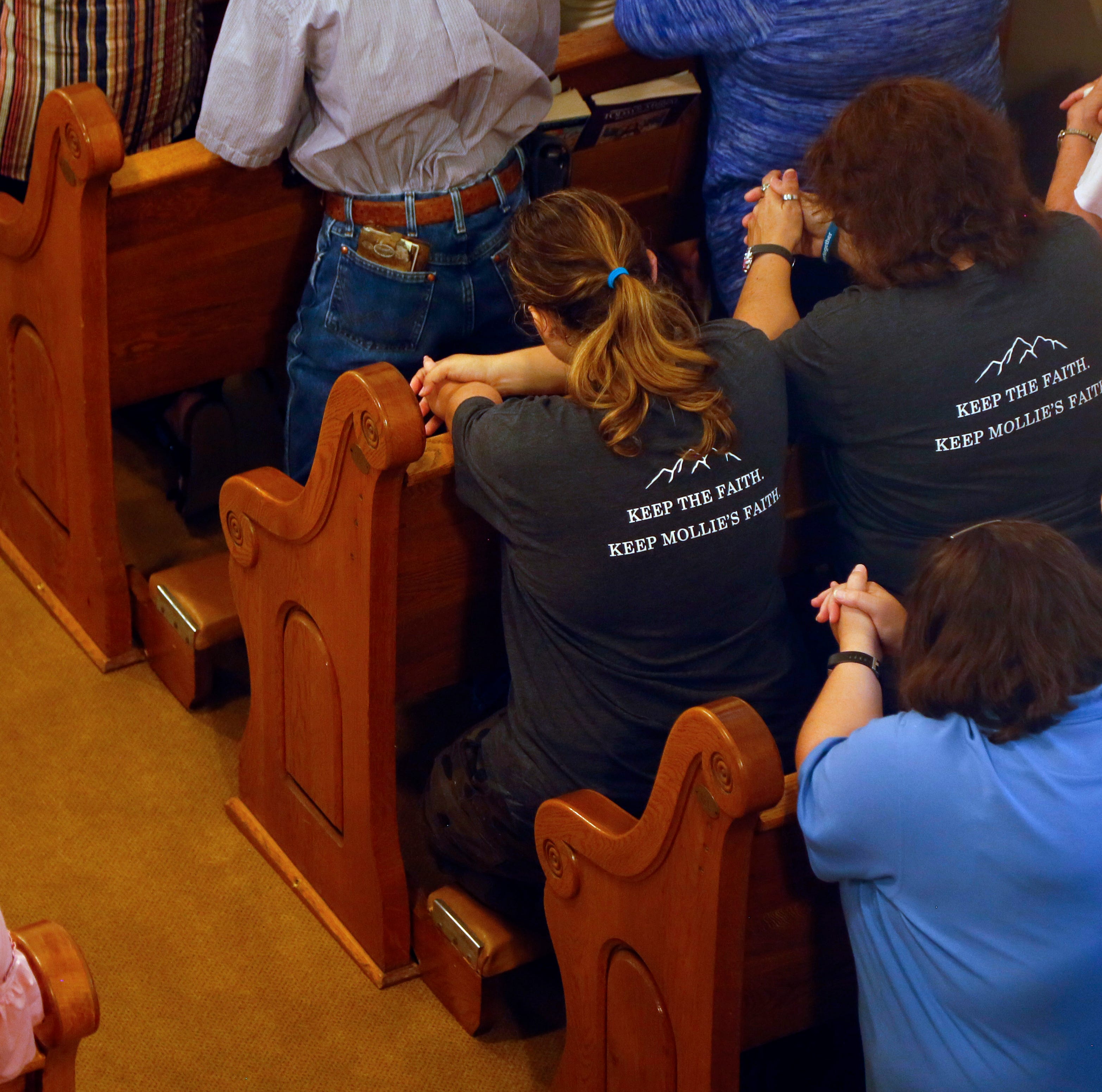 Community members gather for a prayer service in honor of Mollie Tibbetts at St. Patrick Church in Brooklyn Iowa Aug. 22, 2018.