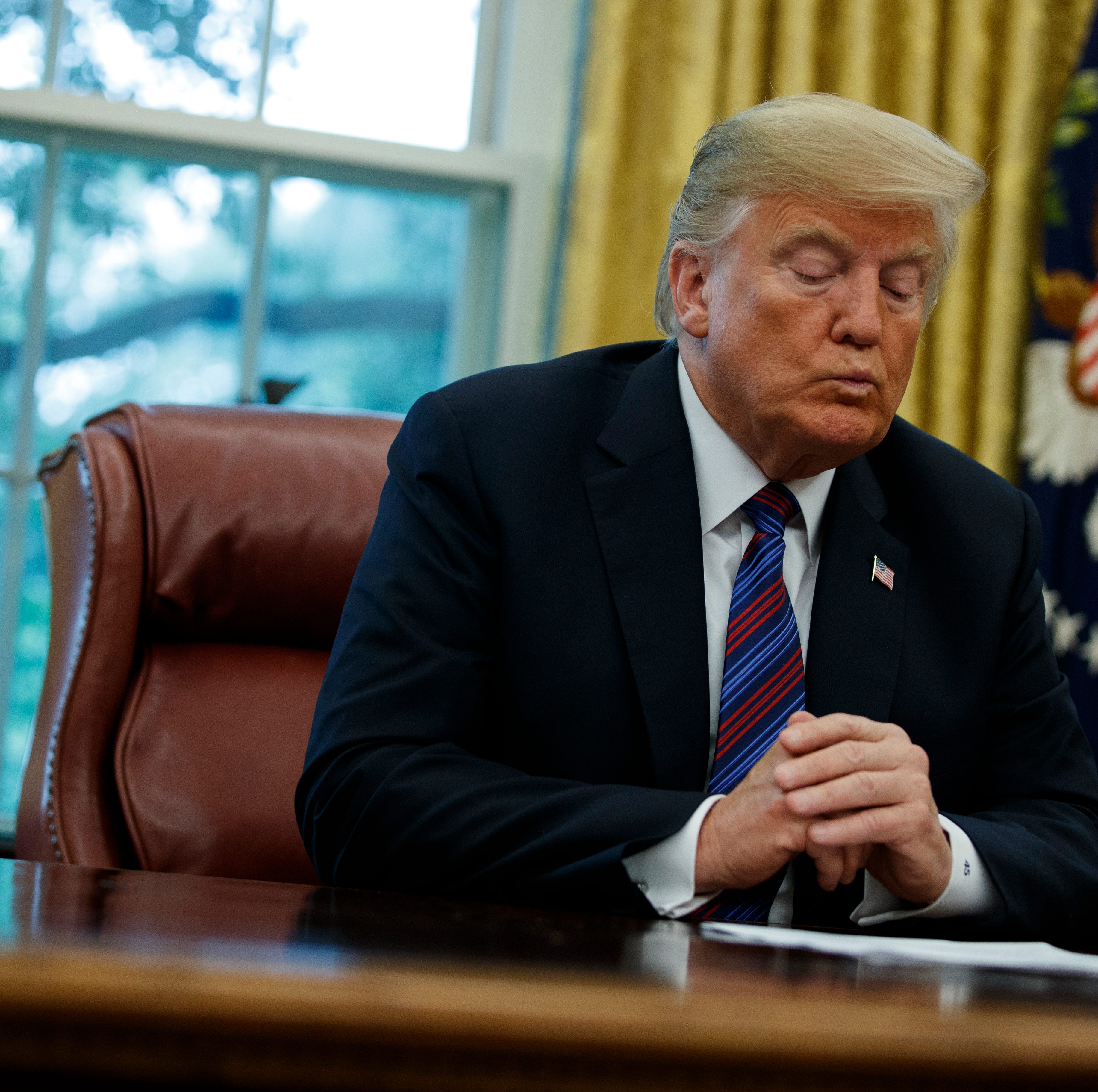 President Donald Trump talks on the phone with Mexican President Enrique Pena Nieto, in the Oval Office of the White House, Monday, Aug. 27, 2018, in Washington. Trump is announcing a trade 