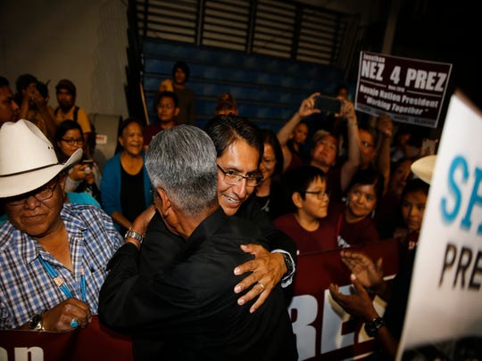 Navajo Nation Presidential candidates Jonathan Nez, hugs his opponent Joe Shirley Jr., Tuesday, Aug. 28, 2018 at the Window Rock Civic Center in Window Rock, Arizona.