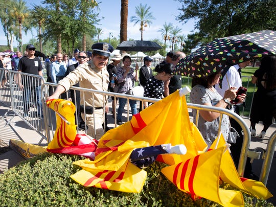 Members of the Arizona Buddhist Zen Community and Arizona Vietnamese-American community pay their respects to Sen.r John McCain as he lies in state in the rotunda at the state Capitol on Aug. 29, 2018.