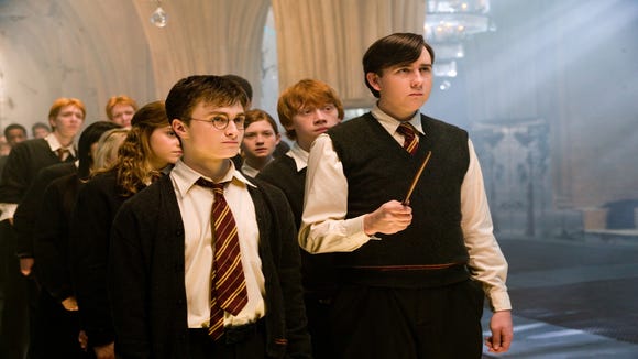 Harry Potter (Daniel Radcliffe, left) leads his comrades at an army meeting of Dumbledore, a student-run resistance organization, in "Harry Potter and the Order of the Phoenix" .