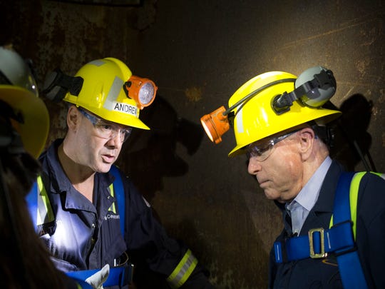 Sen. John McCain (right) talks with project director Andrew Taplin on Oct. 7, 2014, while riding the shaft 10 bucket 1,200 feet to the surface at Superior's Resolution Copper.