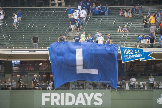 A giant "L" flag was deployed after the Brewers defeated the Cubs, 11-1, on 4 September.