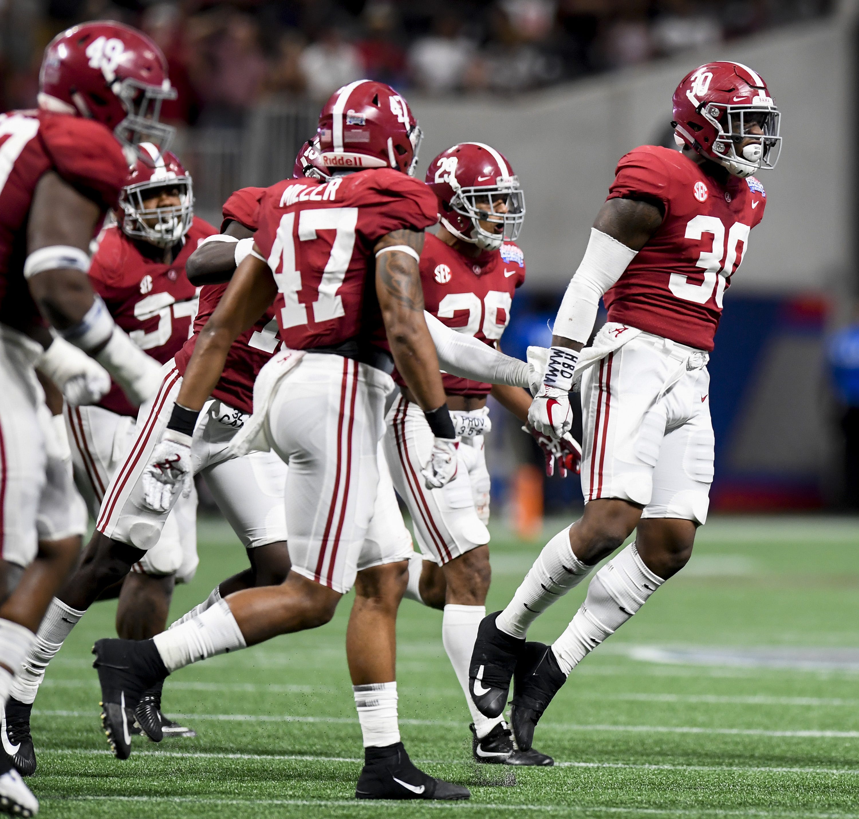 Download Tua Tagovailoa shines under the bright lights of the football  stadium Wallpaper