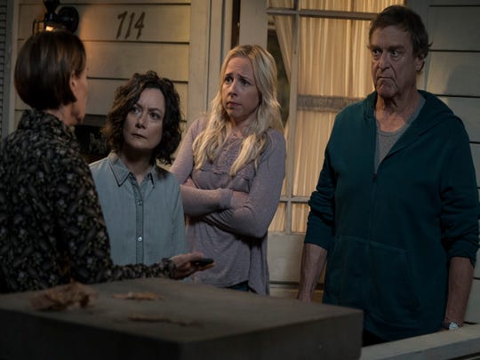Family members (Laurie Metcalf, left, Sara Gilbert, Lecy Goranson and John Goodman) learn how matriarch Roseanne Conner died in the first of the series 