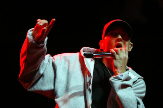 Eminem performs on stage with D12's Kuniva for the release night of his new Relapse album at the Sound Board Stage at Motor City Casino Detroit on Tuesday, May 19, 2009. 