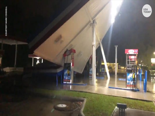 The canopy of the gas station rocked shrieking the winds of Hurricane Florence