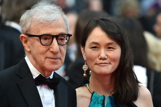 Woody Allen and his wife Soon-Yi Previn pose as they arrive on May 11, 2016 for the screening of the film "Cafe Society" during the opening ceremony of the 69th Cannes Film Festival in Cannes.