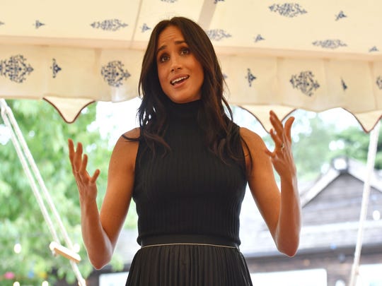 Duchess Meghan addresses guests at the launch of a cookbook with recipes from a group of women affected by the Grenfell Tower fire at Kensington Palace on September 20 2018.