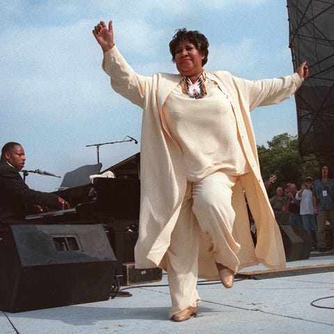 Aretha Franklin dances on stage during the first...