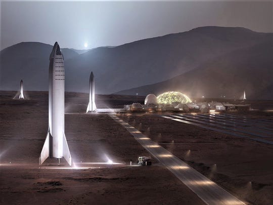 Several space ships SpaceX Big Falcon are seen on the surface of Mars in this rendering published by the company.