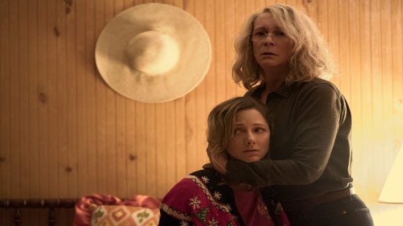 Laurie Strode (Jamie Lee Curtis, right) protects her daughter Karen (Judy Greer) in 