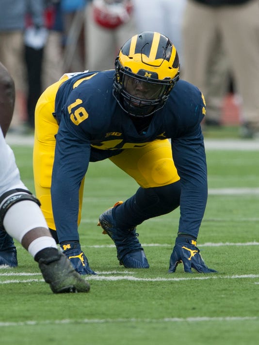 Michigan's Kwity Paye is '100 percent;' Aubrey Solomon still rehabbing