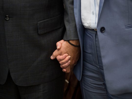 Mark Hazelwood, former president of Pilot Flying J, is holding his hand with his wife Joanne as she leaves the Chattanooga federal court on Wednesday, September 26, 2018.