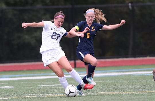 From left, Beacon's Analiese Compagnone (23) and Lourdes'  Maeve Connolly (5) battle for ball control during a girls soccer game at Our Lady of Lourdes in Poughkeepsie Sept. 26, 2018. They played to a 0-0 tie.