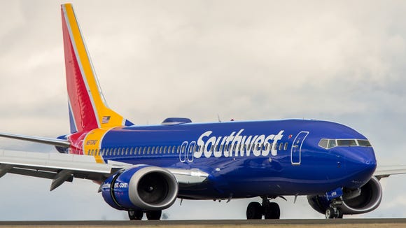 A Southwest Airlines Boeing 737 MAX 8 jet lands at Seattle-Tacoma International Airport in December 2017.