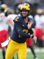 Michigan's Shea Patterson warms up before action against Maryland, Saturday, Oct. 6, 2018 at Michigan Stadium.