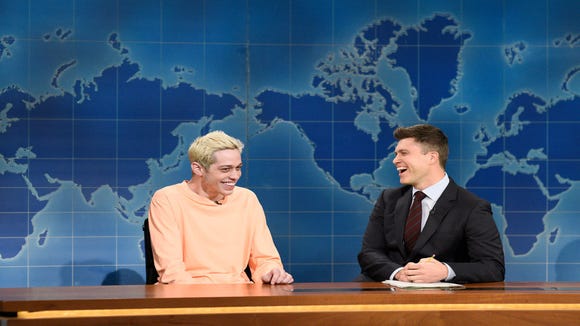 Pete Davidson (left) faces Kanye West alongside Colin Jost during 