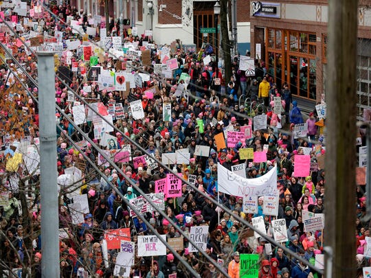 In this photo, taking photo on January 20, 2018, people are participating in the Women's March 2.0, a year after the protest of women around the world defending their rights and protesting against the inauguration of President Trump in Seattle, in the state of Washington. - Stimulated by a fierce fight against a candidate for the judiciary in the US Supreme Court, thousands of women had to march in Chicago on Saturday and vote early for the mid-term polls. 