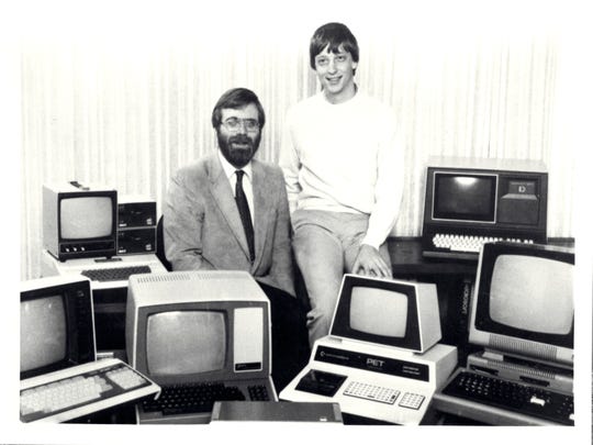 Microsoft co-founders Paul Allen and Bill Gates are surrounded by personal computers shortly after signing a major contract with IBM for writing software for their personal computer lineup.