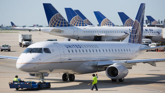 A United Express Embraer plane is being pushed back for its departure from the Chicago Oporto International Airport in June 2015.