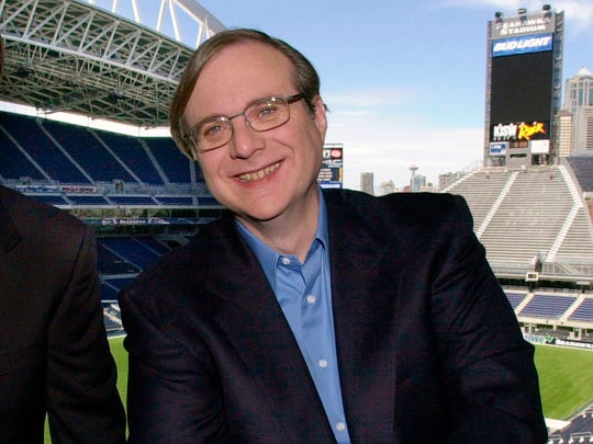DOSSIER - In this photo of July 17, 2001, Paul Allen, owner of the Seattle Seahawks, appears in a suite of the team's Seattle stadium. Allen, the billionaire owner of Trail Blazers and co-founder of Seattle Seahawks and Microsoft, died Monday, October 15, 2018 at the age of 65. Earlier this month, Allen said that the cancer for which he had been treated in 2009 had returned. (AP Photo / Elaine Thompson, File) ORG XMIT: NYCL104