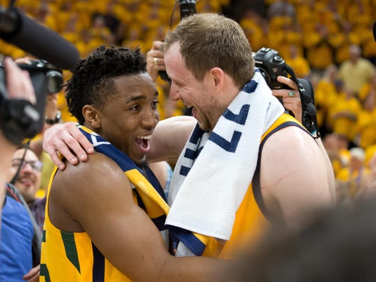 Donovan Mitchell and Joe Ingles react after a decisive victory against the Thunder Oklahoma City.