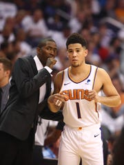 Oct 17, 2018; Phoenix, AZ, USA; Phoenix Suns guard Jamal Crawford (left) talks with guard Devin Booker against the Dallas Mavericks at Talking Stick Resort Arena. Mandatory Credit: Mark J. Rebilas-USA TODAY Sports