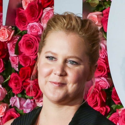 Actress Amy Schumer and husband Chris Fischer are...