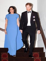 Prince Harry and Duchess Meghan of Sussex attend a state dinner on October 23, 2018 in Suva, Fiji.