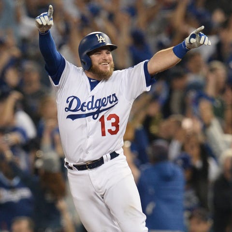 Max Muncy celebrates after hitting a walk-off...