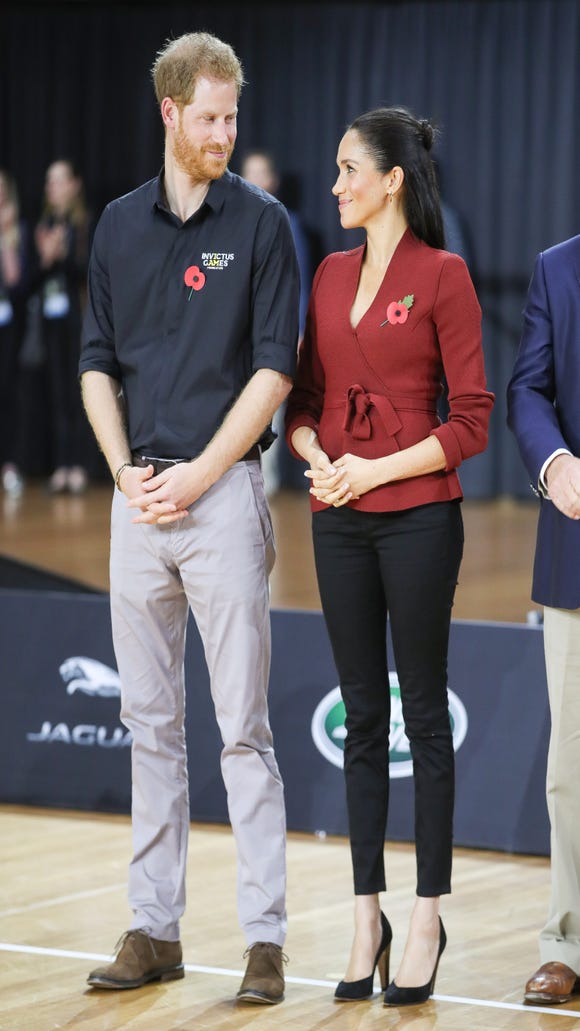 The Duke and Duchess exchange glances on the gold metal match for wheelchair basketball at the Sydney Invictus Games 2018.