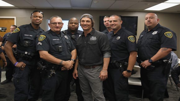 Matthew McConaughey takes photos with Houston's Police Department officers during Wild Turkey gives back 2018 with Matthew McConaughey on October 28, 2018 in Houston, Texas.