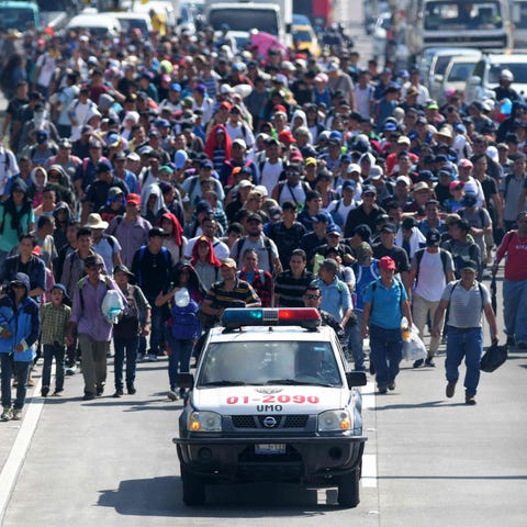 Migrants embark on a journey in caravan to the...