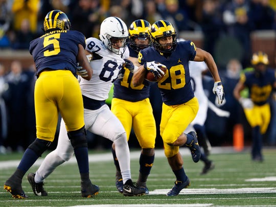 Michigan defenseman Brandon Watson (28) scored a 62-yard interception of a touchdown in the second half of an NCAA college football game against the Penn State at Ann Arbor in Michigan, Saturday, November 3, 2018. (AP Photo / Paul Sancya)