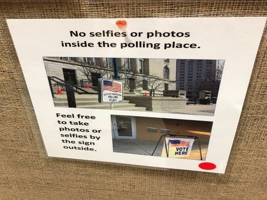 This sign was pasted on a bulletin board outside a Memorial Union polling station on the UW-Madison campus.