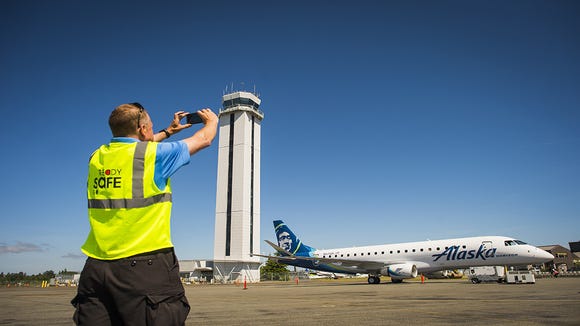 This photo provided by Alaska Airlines shows an Embraer E175 of Horizon Air affiliate at Paine Field in Everett, Washington.