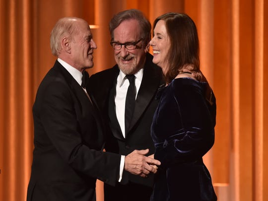 Steven Spielberg (center) embraces producer Kathleen Kennedy (right) and producer Frank Marshall when they accept the Irving G. Thalberg Memorial Award at the 10th Annual Governors Awards.